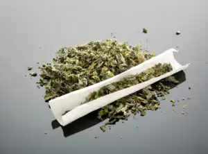 Mary Jane when state-legal - Fairfax criminal lawyer addresses side risks - Photo of marijuana and rolling paper