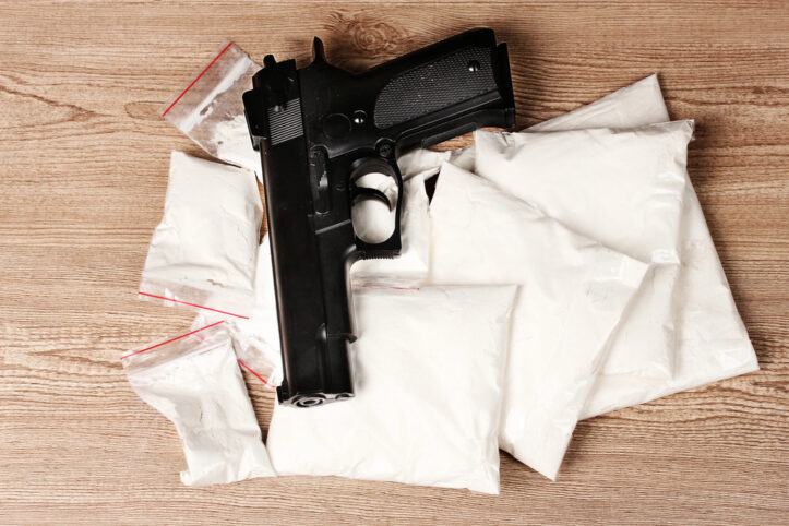 Contraband defense addressed by Fairfax criminal lawyer- Photo of handgun and cocaine
