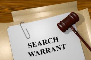 Emergency aid exception addressed by Fairfax criminal defense lawyer- Image of search warrant cover page