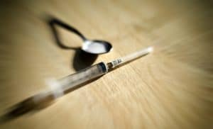 Imitation drug sales is a Virginia crime says Fairfax criminal lawyer- Photo of heroin spoon & syringe