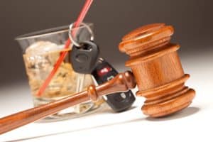 Virginia DUI case negotiations will shift with new restricted driving law- Photo of gavel and liquor glass