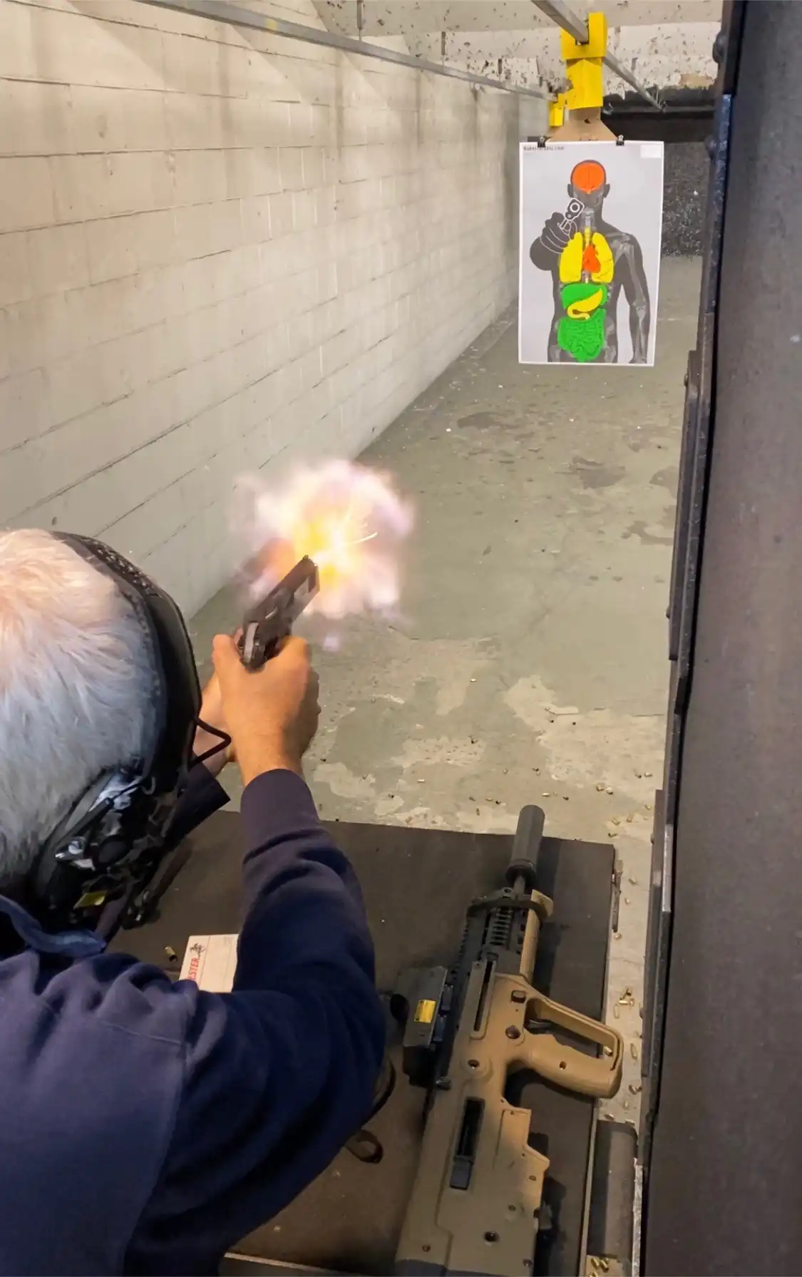 Embracing the 2nd Amendment is critical for the criminal defense- Image of Jon Katz firing shooting a pistol- Copyrighted